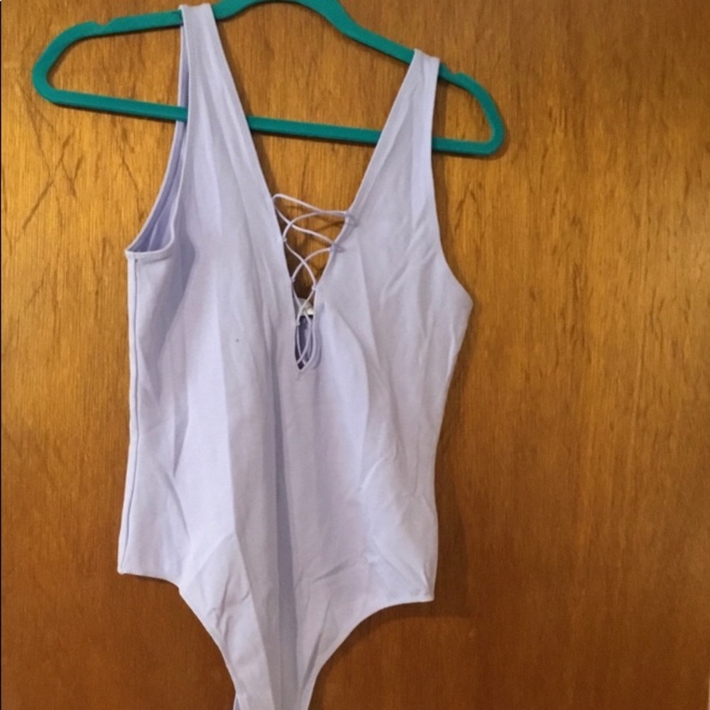 Periwinkle color size l body suit from Artizia.